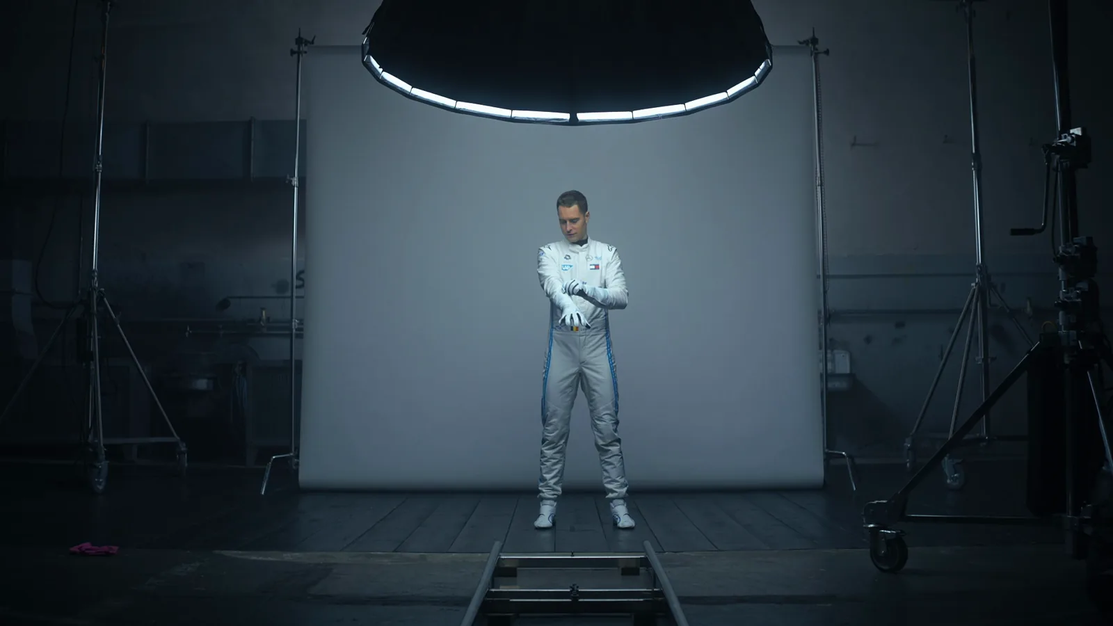 A Mercedes-EQ Formula E driver in the racing garage.